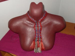 Kakahu neckpiece displayed on clay torso 1